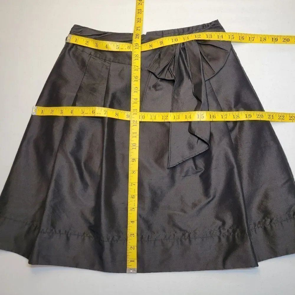 Trina Turk Silk Crepe Black A-Line Pleated Midi Skirt Bow Ties Waist Pockets